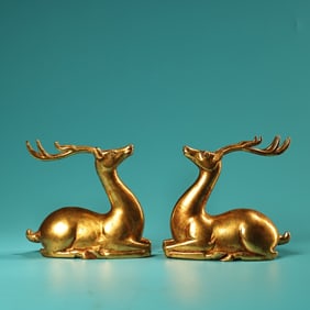 A pair of Rare High Relief Carved Coppery Gilded Deer
