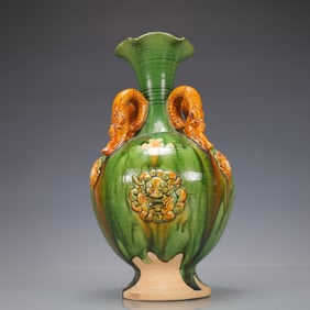 A Exquisite Trio-colored glazed pottery of the Tang Dynasty Beast-Face Pattern Double-Ears Vase