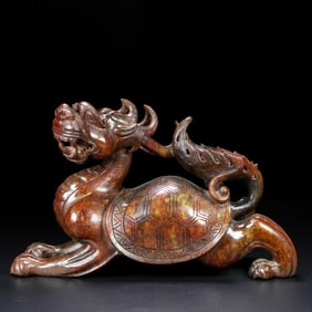 An Exquisite White Jade Auspicious Beast Ornament