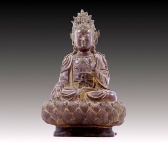 A solemn bronze Buddha statue