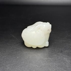 An Exquisite White Jade Auspicious Beast Hand Piece