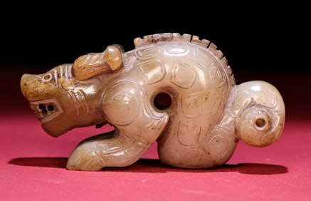 An Exquisite White Jade Auspicious Beast Hand Piece