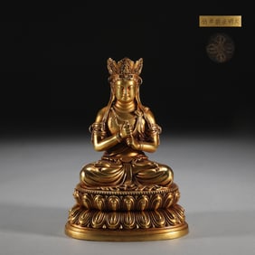 A Rare Gilt Bronze Vairocana Buddha Seated Statue