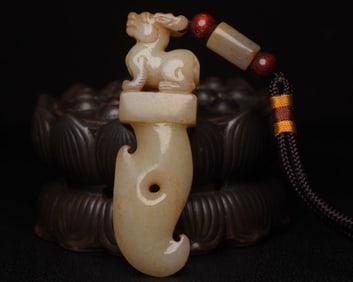 A Rare Hetian Jade Auspicious Beast-Shaped Pendant