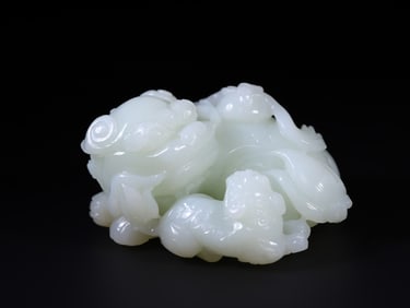 A Rare Hetian Jade Lion-Shaped Ruyi Ornament