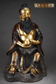 A Rare Gilded Purple Copper Body Dongfang Shuo Seated Statue