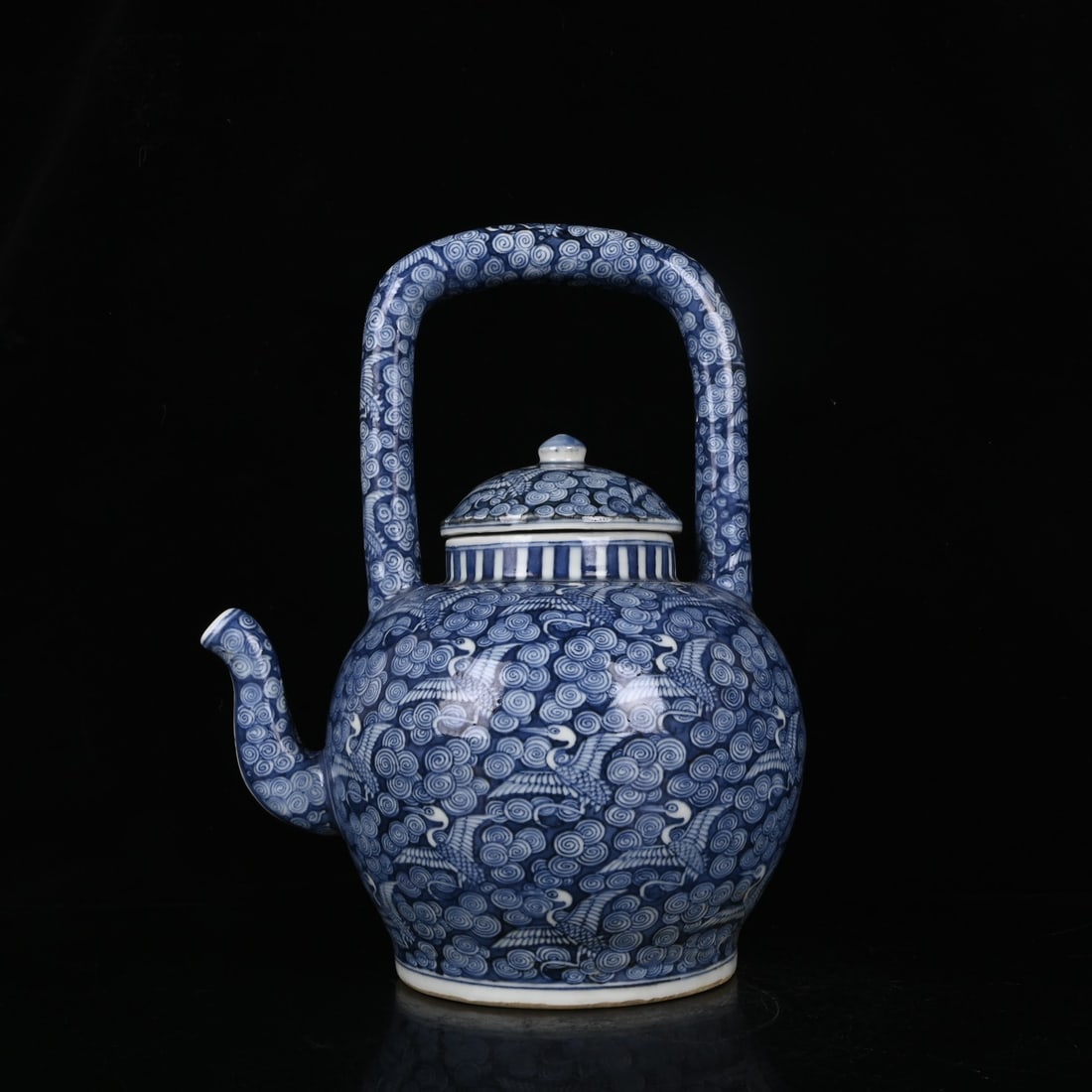 An Exquisite Blue and White Auspicious Cloud and Crane Pattern Ewer: An Exquisite Blue and White Auspicious Cloud and Crane Pattern Ewer,Ming Dynasty,China,Longqing Six-Character Mark,Size:11.8inx9.1in 青花祥云仙鹤纹执