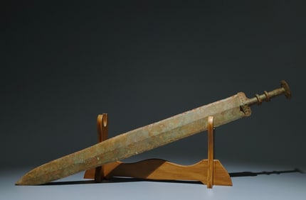 A Rare Gilt Bronze Sword Ornament