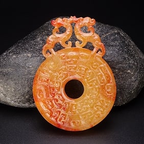 An Exquisite White Jade Dragon Pendant