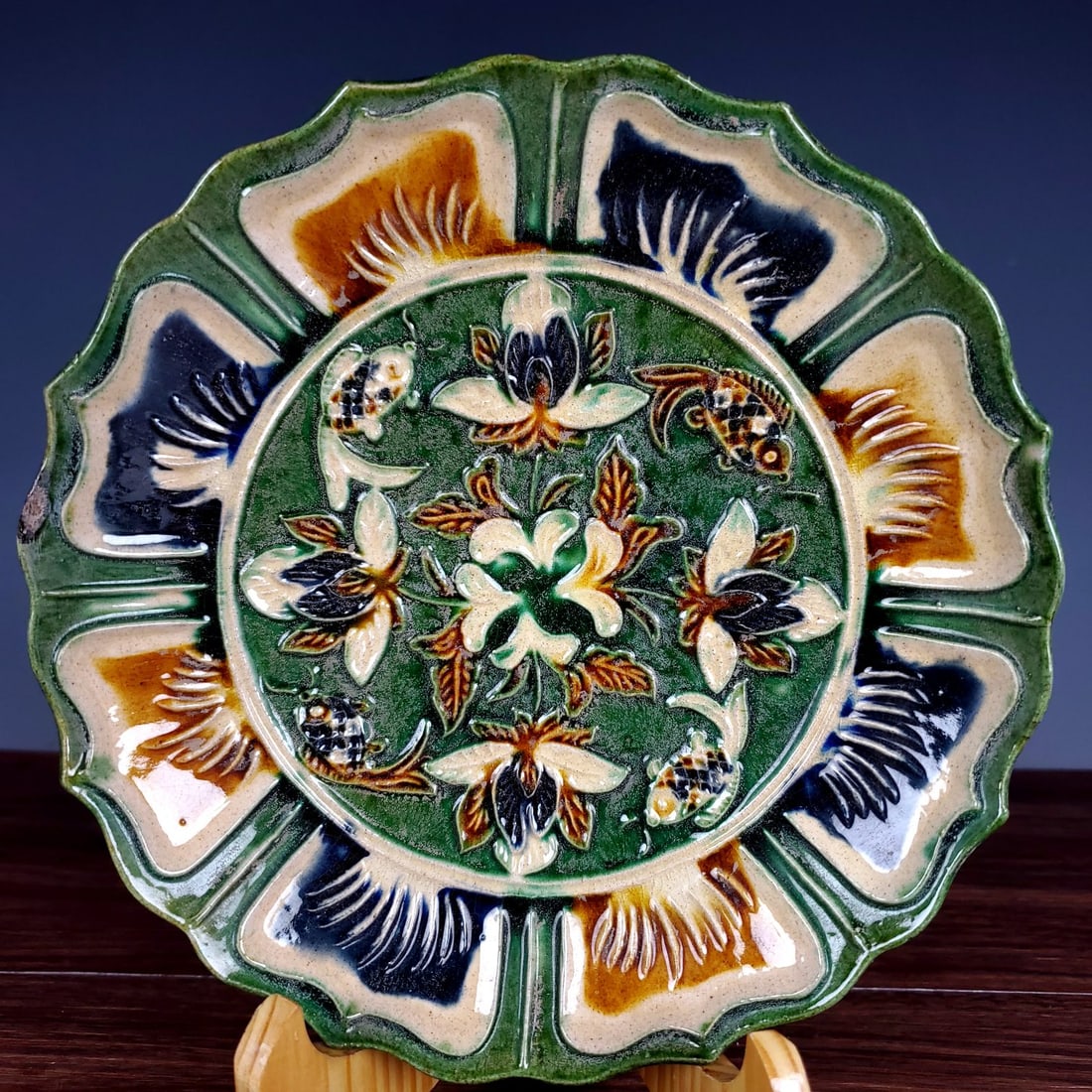 A Rare Tang Tri-Color Glazed Pottery Flower and Fish Pattern Plate: A Rare Tang Tri-Color Glazed Pottery Flower and Fish Pattern Plate,Tang Dynasty,China,Size:1.6inx7.2in 唐三彩花卉鱼纹盘,中国唐代