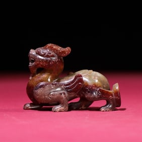 An Exquisite White Jade Auspicious Beast Hand Piece