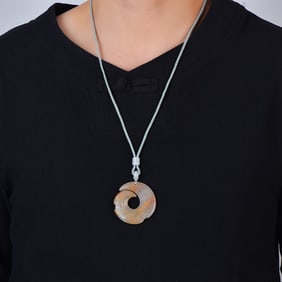 An Exquisite White Jade Pendant