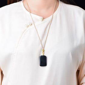 An Exquisite White Jade Pendant