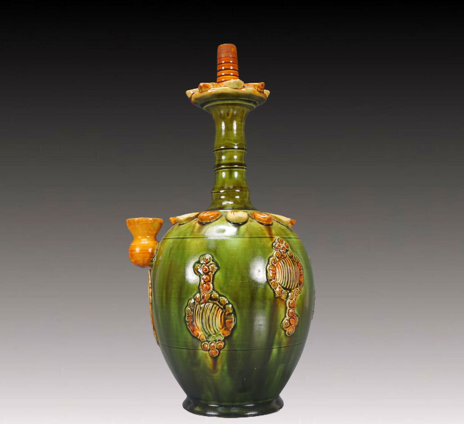 An Exquisite Tang Tri-Color Glazed Pottery Flower Pattern Vase: An Exquisite Tang Tri-Color Glazed Pottery Flower Pattern Vase,Tang Dynasty, China,Size:7.5inx7.1inx10.2in,Weight:1500g 唐三彩花卉纹瓶，中国