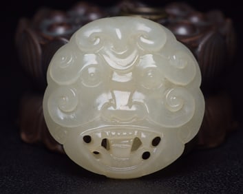 An Exquisite White Jade Auspicious Beast Pendant