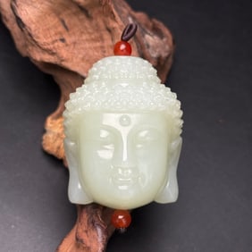 An Exquisite White Jade Buddha-head Pendant