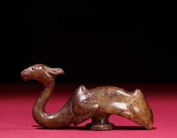An Exquisite White Jade Camel Hook