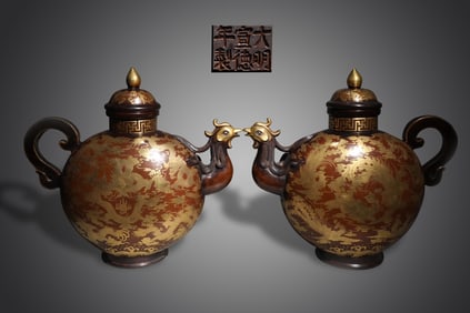 A Pair of Gilt Bronze Dragon and Phoenix Pattern Ewers