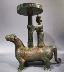 An Archaic Bronze Figure Auspicious Beast Candlestick