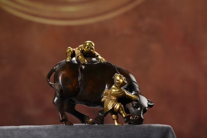 An Exquisite Gilt Bronze Figure and Buffalo Ornament
