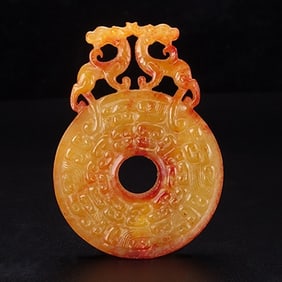 An Exquisite White Jade Dragon Pendant