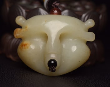 An Exquisite White Jade Auspicious Beast Pendant