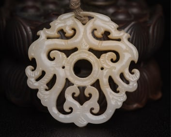 An Exquisite White Jade Dragon Pendant