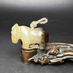 An Exquisite White Jade Buffalo Pendant