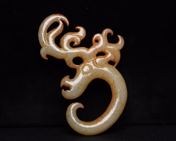 An Exquisite White Jade Dragon Pendant