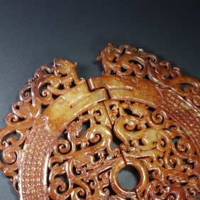 An Exquisite White Jade Dragon Pendant