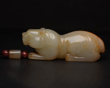 An Exquisite White Jade Auspicious Beast Pendant