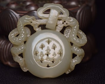 An Exquisite White Jade Dragon Pendant