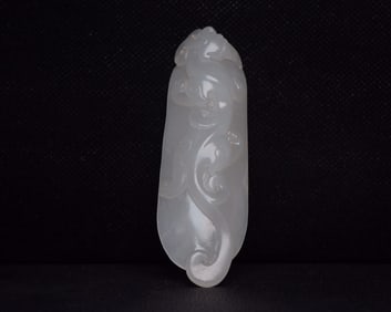 An Exquisite White Jade Auspicious Beast Pendant