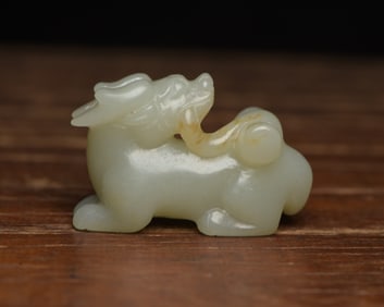 An Exquisite White Jade Beast Pendant