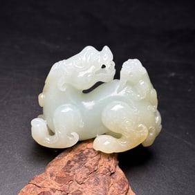 An Exquisite White Jade Auspicious Beast Ornament