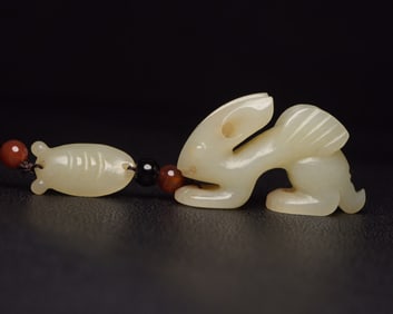 An Exquisite White Jade Auspicious Beast Pendant