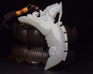 An Exquisite White Jade Auspicious Beast Pendant