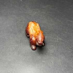 An Exquisite White Jade Auspicious Beast Pendant