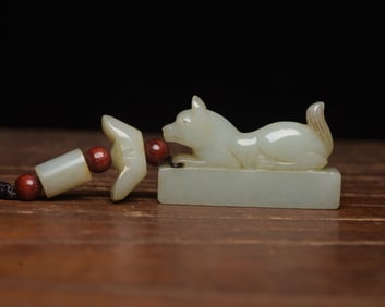 An Exquisite White Jade Dog Pendant