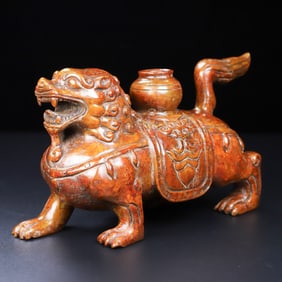 An Exquisite White Jade Lion Ornament