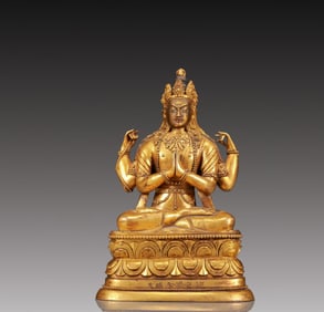 A Solemn Gilt Bronze Statue of Four-arms Guanyin