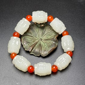An Exquisite White Jade Buddha-Face Pattern Bracelets