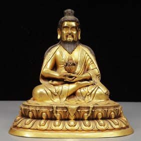 A Solemn Gilt Bronze Statue of Guru
