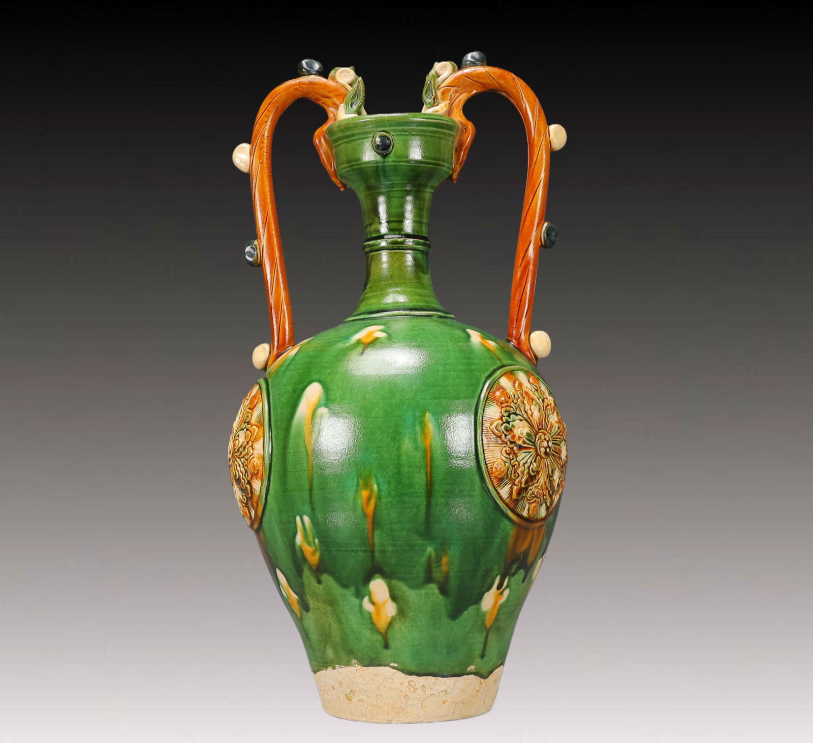 A Huge Tang Tri-Color Glazed Pottery Flower Pattern Dragon-Ears Vase: A Huge Tang Tri-Color Glazed Pottery Flower Pattern Dragon-Ears Vase,Tang Dynasty, China,Size:9.4inx9.4inx17.7in,Weight:3900g 唐三彩花卉纹龙耳瓶&#