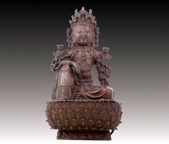 A solemn bronze Buddha statue