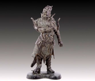 A solemn bronze figure