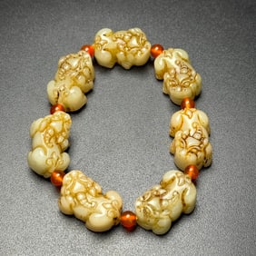 An Exquisite White Jade Auspicious Beast-Shaped Bracelets