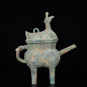 An Archaic Bronze Phoenix Pattern Four Legs Ewer