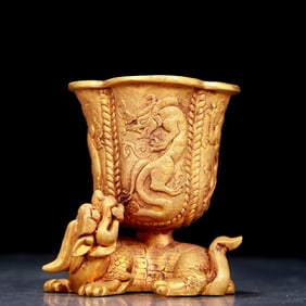 An exquisite gilt bronze cup with auspicious animal patterns