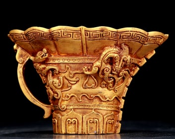 An exquisite gilt bronze cup with dragon pattern